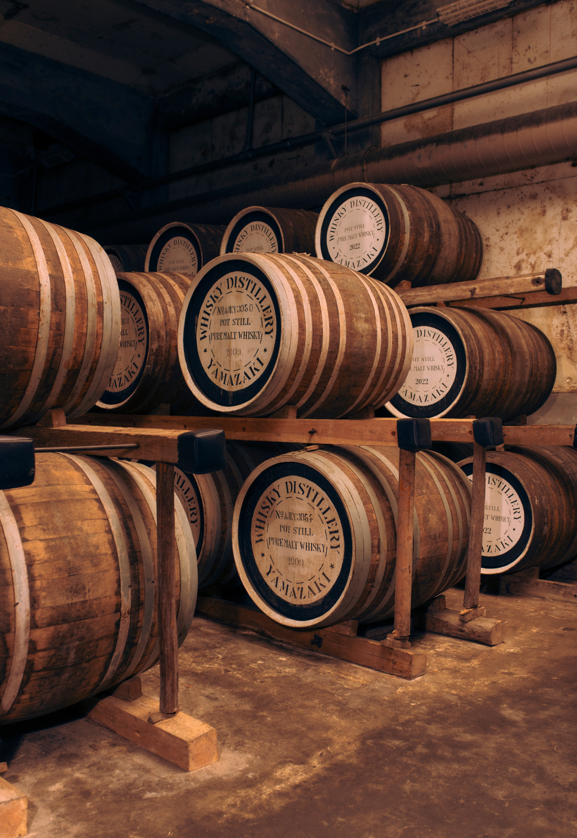 Photo of barrels stacked in a barrel room at Suntory’s Yamazaki Distillery