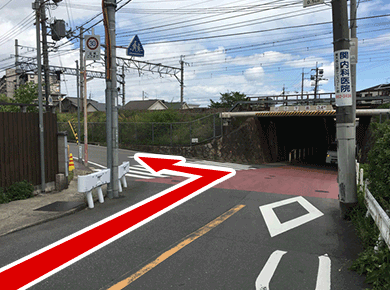 Turn left just before the railroad track.