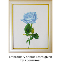 Embroidery of blue roses given by a consumer