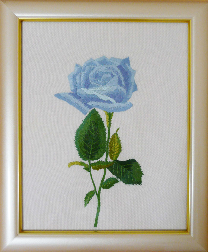 Embroidery of blue roses given by a consumer